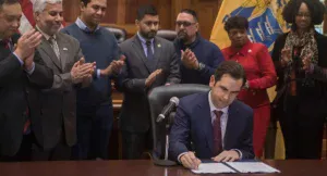Mayor Steve Fulop signs into law the purchase of 5 electric refuse trucks for Jersey City